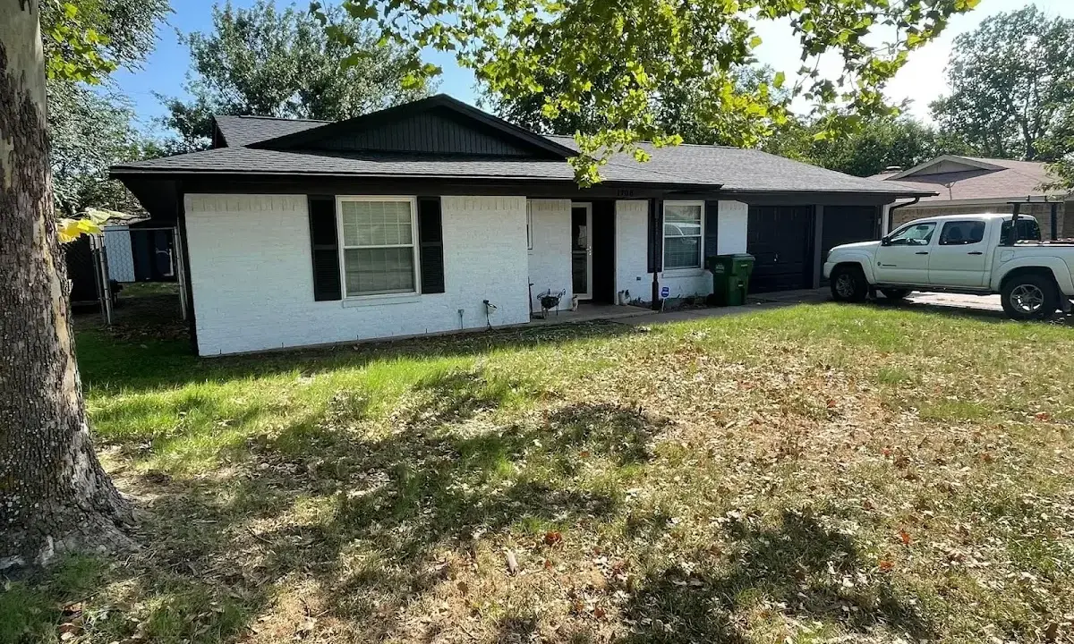 Professional roofing crew working on a residential roof in San Carlos
